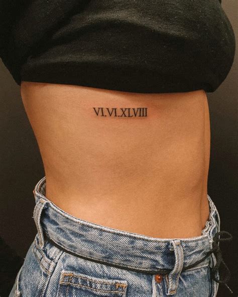 roman numerals rib tattoo